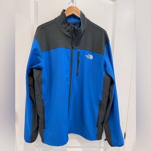 The North Face Blue Lightweight Soft Jacket with Black Trim zipper pockets